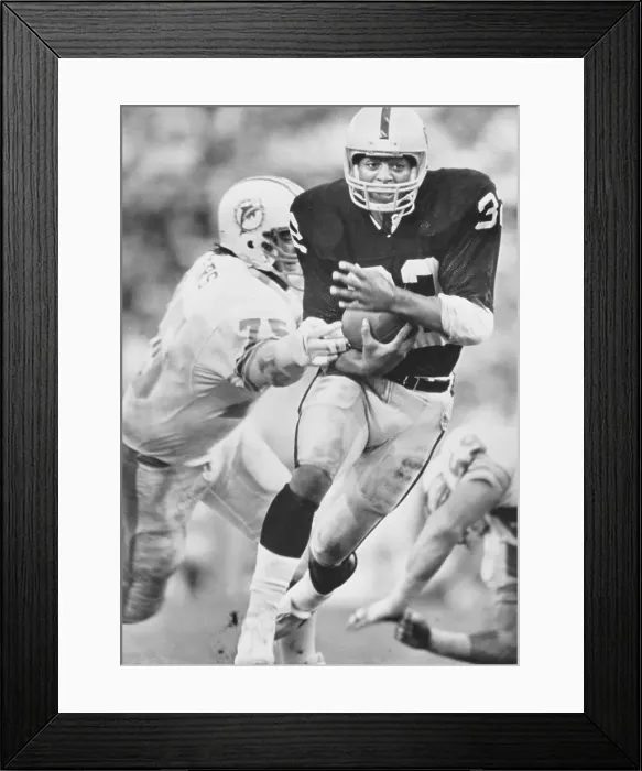 Framed Print : Marcus Allen Escaping Clutches of Doug Betters in Football Action Framed Print : Marcus Allen Escaping Clutches of Doug Betters in Football Action
