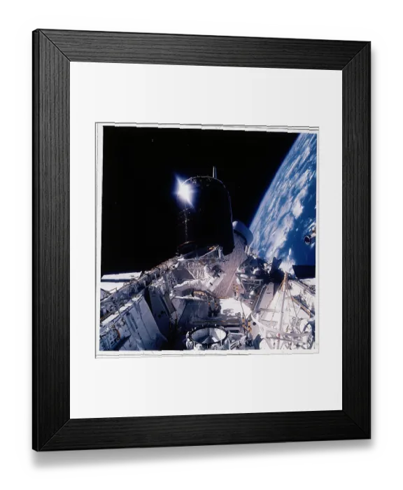 Framed Print : Dale Gardner Works on Satellite in Orbit Framed Print : Dale Gardner Works on Satellite in Orbit