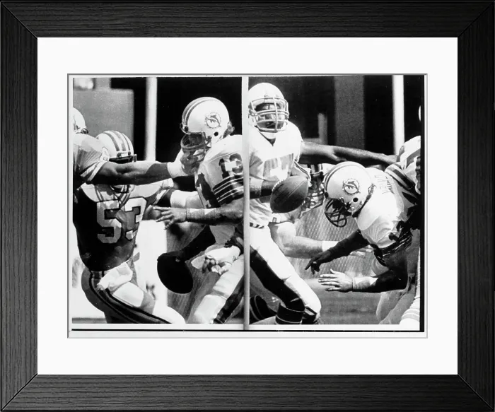 Framed Print : Dan Marino has Face Mask Pulled and Drops Ball During Game