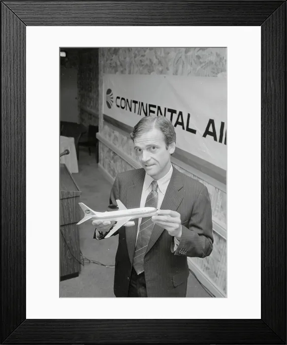 Framed Print : Frank Lorenzo Holding Model Airplane Framed Print : Frank Lorenzo Holding Model Airplane