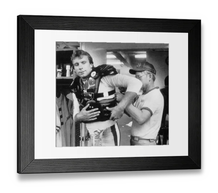 Framed Print : Man Helps Joe Montana With Rib Cage Guard Framed Print : Man Helps Joe Montana With Rib Cage Guard