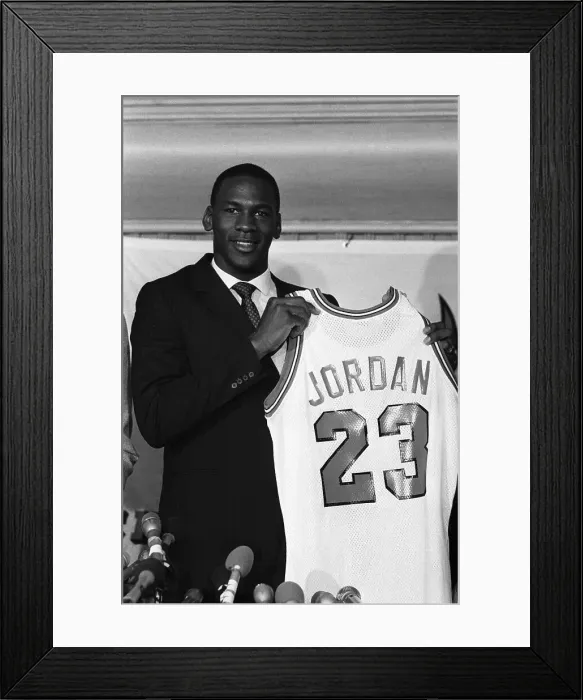 Framed Print : Michael Jordan Displaying His Team Jersey Framed Print : Michael Jordan Displaying His Team Jersey