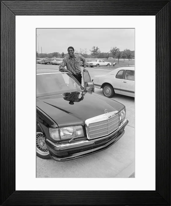 Framed Print : Akeem Olajuwon Standing by Car Framed Print : Akeem Olajuwon Standing by Car