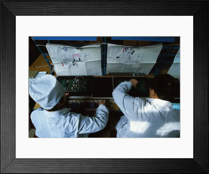Framed Print : Chinese Workers with Multi Meter Device