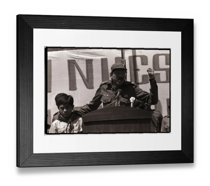 Framed Print : Commander Ortega Holds Child and Speaks Framed Print : Commander Ortega Holds Child and Speaks