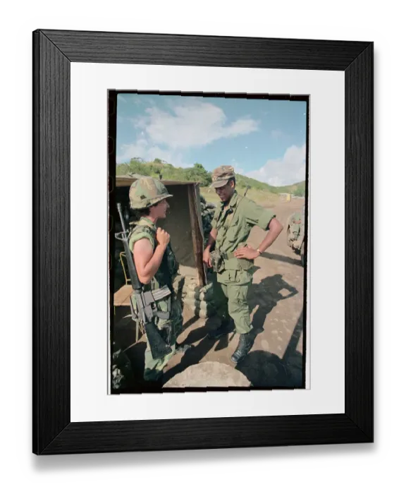 Framed Print : Female Soldier Holding Gun Speaking to Male Soldier Framed Print : Female Soldier Holding Gun Speaking to Male Soldier