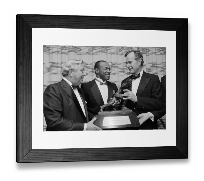 Framed Print : Mike Rozier Showing Heisman Trophy to George Bush Framed Print : Mike Rozier Showing Heisman Trophy to George Bush