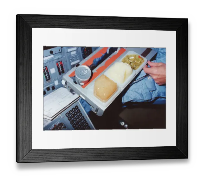 Framed Print : Astronaut with Tray of Columbia Food Framed Print : Astronaut with Tray of Columbia Food