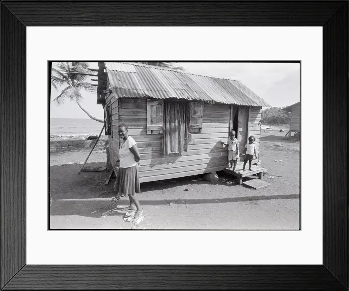 Framed Print : Woman Sweeping in Front of House Framed Print : Woman Sweeping in Front of House