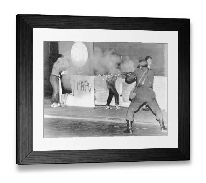 Framed Print : Riot Policeman Firing at Protesters Framed Print : Riot Policeman Firing at Protesters