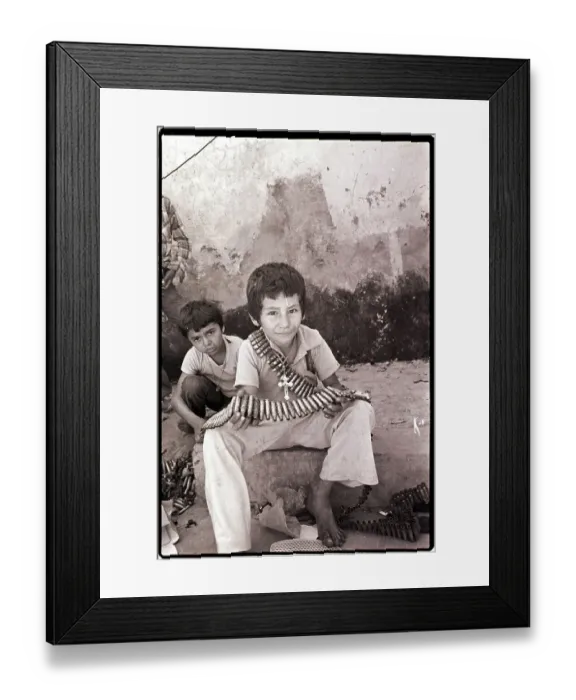 Framed Print : Boy Holding Used Cartridge String