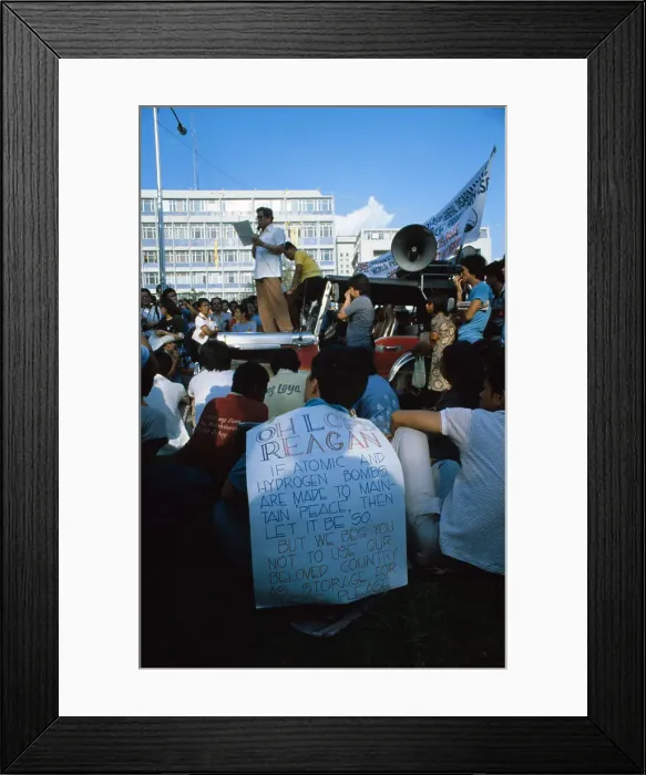 Framed Print : Speaker Standing atop Car