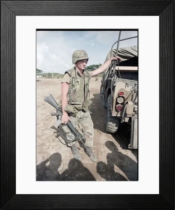 Framed Print : Lone Soldier in Grenada Leans on Truck Framed Print : Lone Soldier in Grenada Leans on Truck