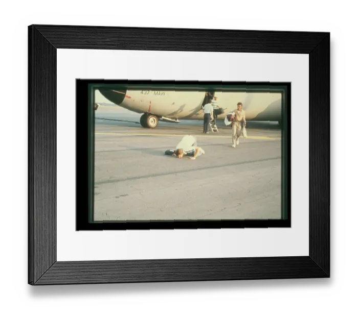 Framed Print : Evacuated Student Kisses Runway Framed Print : Evacuated Student Kisses Runway
