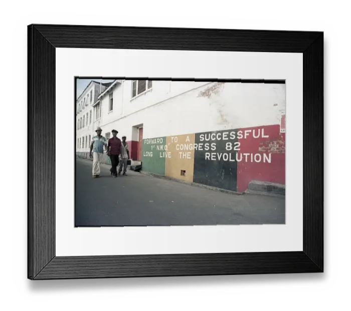 Framed Print : Grenadians Walk Past A Revolution Mural Framed Print : Grenadians Walk Past A Revolution Mural