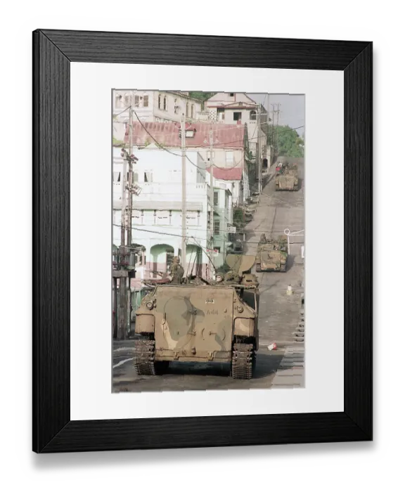 Framed Print : Military Vehicle Drives Down Street Framed Print : Military Vehicle Drives Down Street