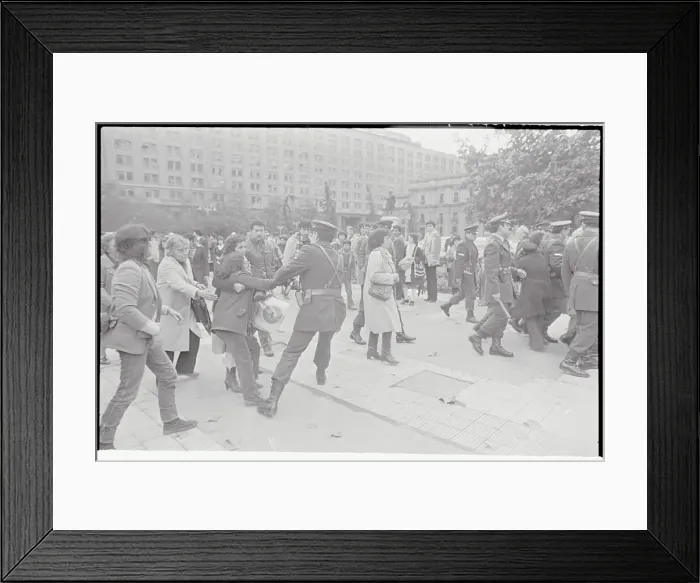 Framed Print : Woman Struggling with Police Officer Framed Print : Woman Struggling with Police Officer