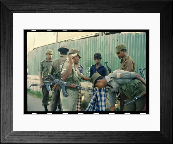 Framed Print : Soldiers Searching Boy's Belongings Framed Print : Soldiers Searching Boy's Belongings