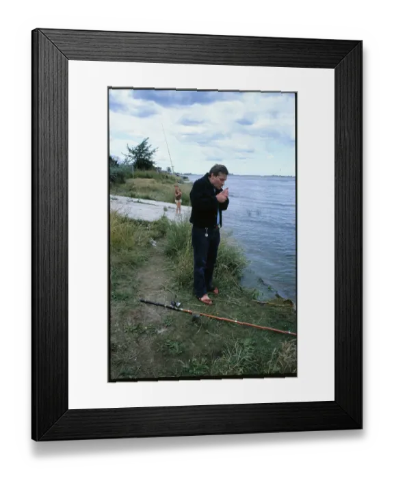 Framed Print : Lech Walesa Fishing and Smoking