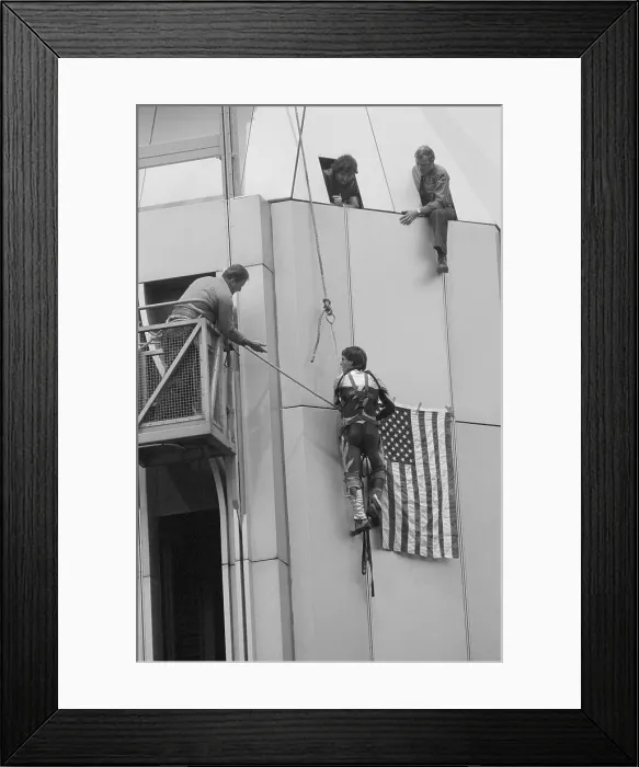 Framed Print : Man Climbing One of the Twin Towers