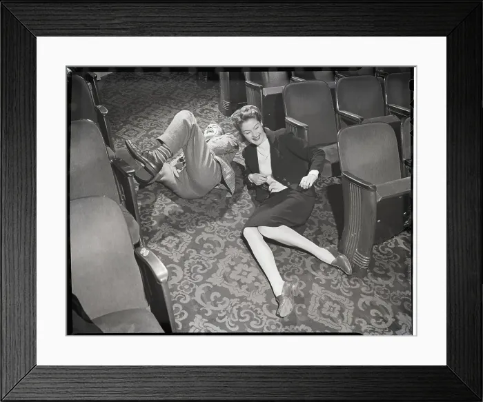 Framed Print : Couple Rolling in Aisle of Theater Framed Print : Couple Rolling in Aisle of Theater