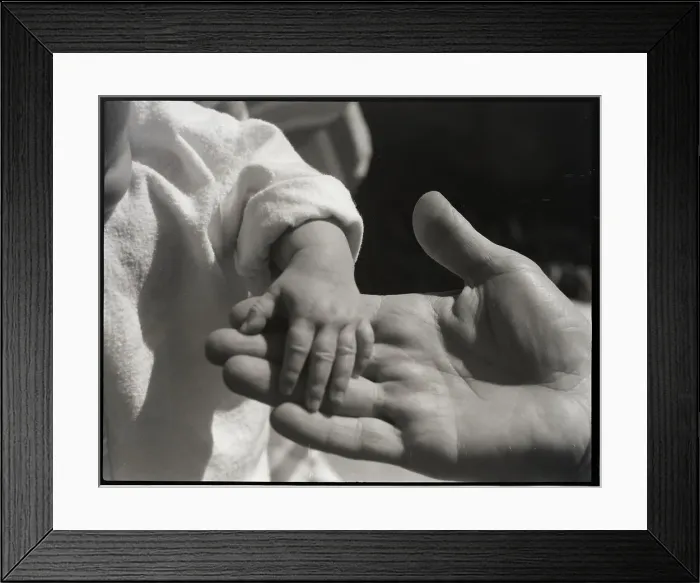 Framed Print : Infant's Hand in Man's Hand Framed Print : Infant's Hand in Man's Hand