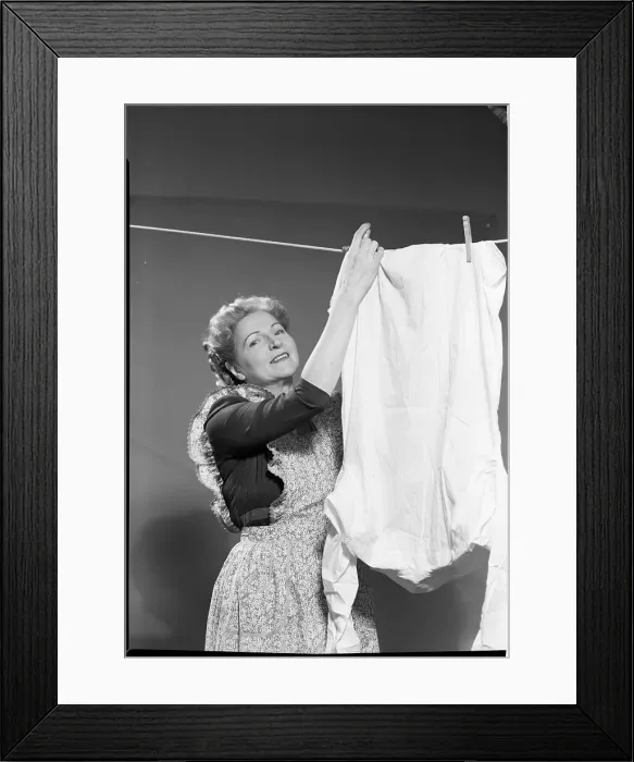 Framed Print : Woman Hanging Laundry Framed Print : Woman Hanging Laundry