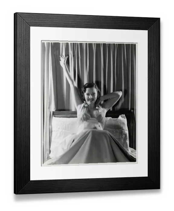 Framed Print : Woman Smiling and Stretching in Bed