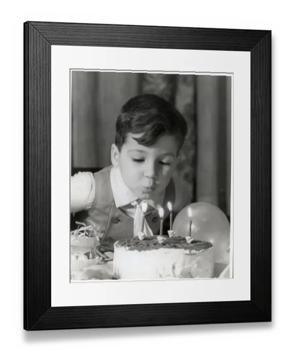Framed Print : Boy Blowing Out Birthday Candles Framed Print : Boy Blowing Out Birthday Candles