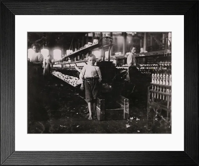 Framed Print : Boy Bashfully Posing in Yarn factory Framed Print : Boy Bashfully Posing in Yarn factory