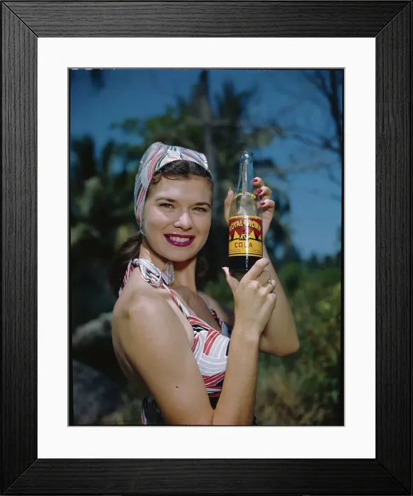Framed Print : Woman Holding a Soda Bottle Framed Print : Woman Holding a Soda Bottle