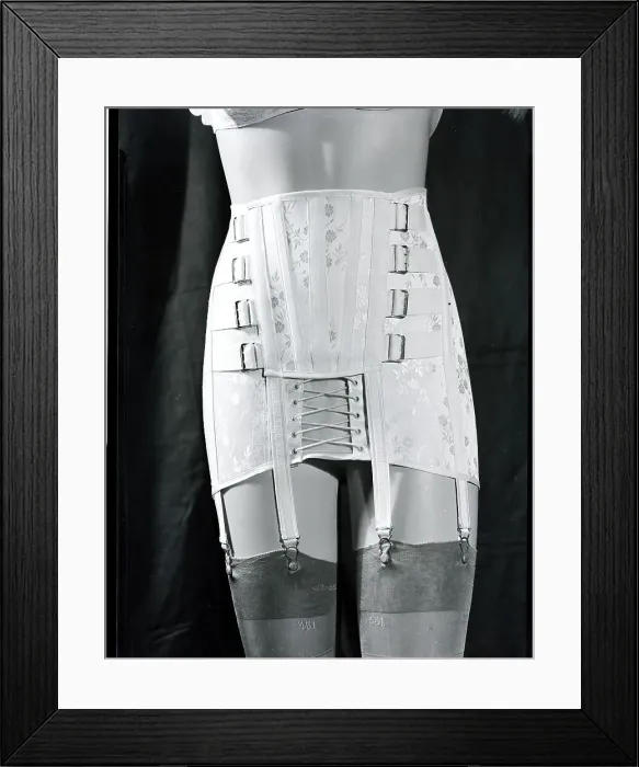 Framed Print : Girdle With Garters Displayed on Mannequin Framed Print : Girdle With Garters Displayed on Mannequin