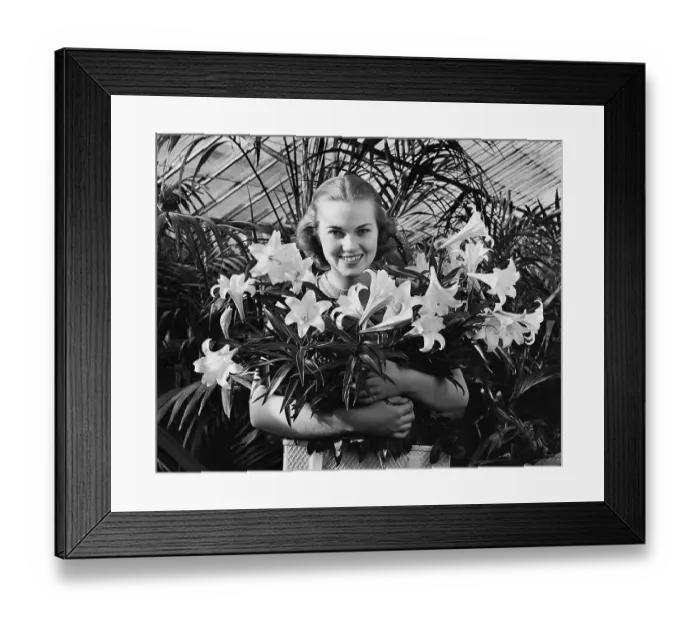 Framed Print : Young Woman with Arms Full of Easter Lillies Framed Print : Young Woman with Arms Full of Easter Lillies