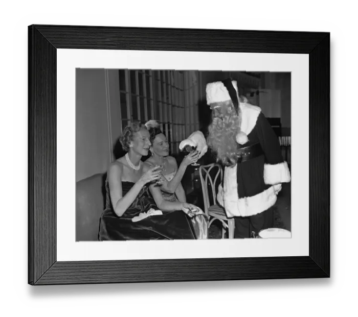 Framed Print : Santa Claus Pours Champagne for Women Framed Print : Santa Claus Pours Champagne for Women