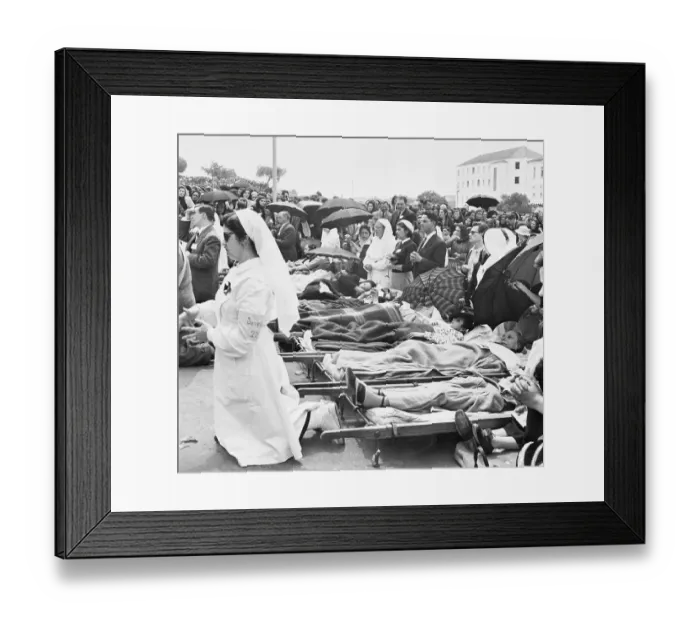 Framed Print : Crowds Surrounding People on Cots Framed Print : Crowds Surrounding People on Cots