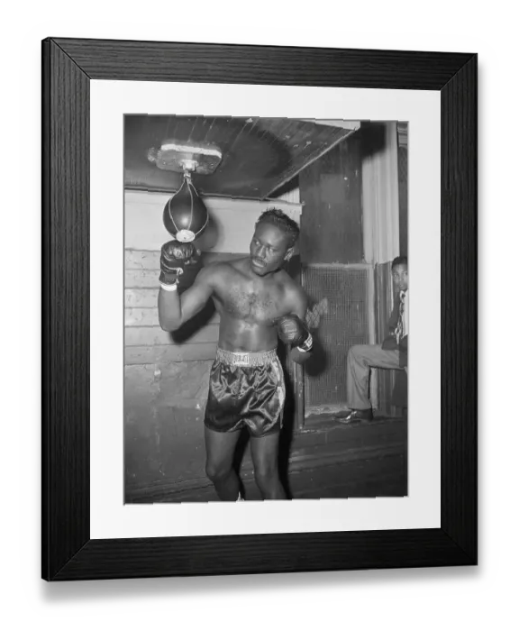 Framed Print : Ezzard Charles Punching Bag