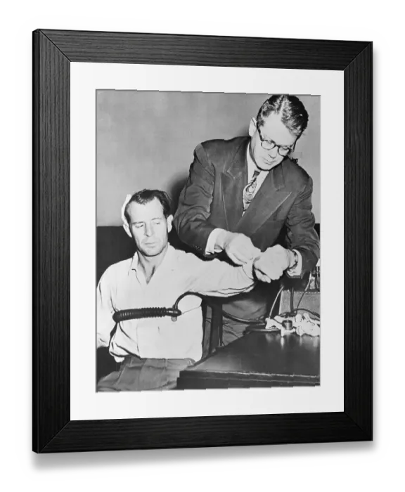 Framed Print : Doctor Preparing Murder Suspect for Lie Detector Test Framed Print : Doctor Preparing Murder Suspect for Lie Detector Test