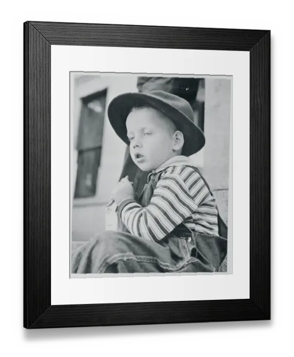 Framed Print : Boy Wearing Hat and Eating Treat Framed Print : Boy Wearing Hat and Eating Treat