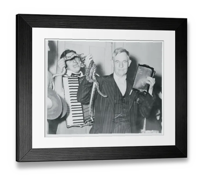 Framed Print : Oscar Hutton Holding Bible and Snakes Framed Print : Oscar Hutton Holding Bible and Snakes