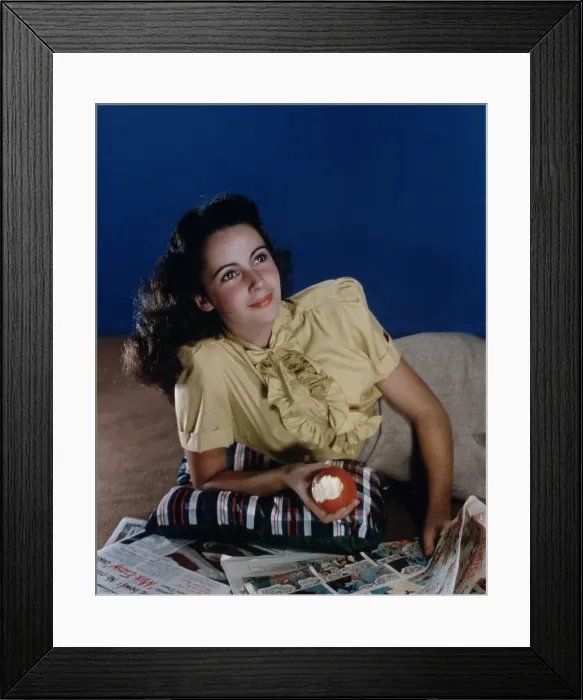 Framed Print : Elizabeth Taylor Reading the Funnies Framed Print : Elizabeth Taylor Reading the Funnies