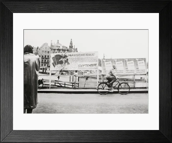 Framed Print : Man Riding Past Communist Posters Framed Print : Man Riding Past Communist Posters