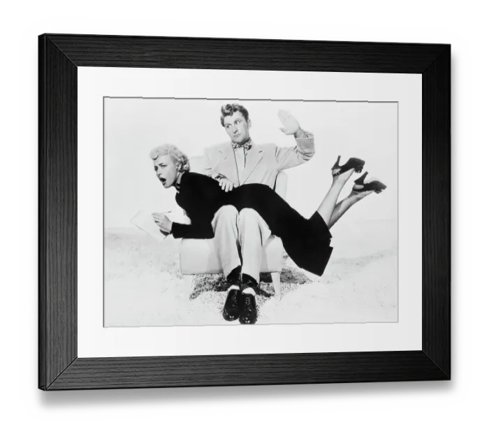 Framed Print : Kirk Douglas with Laraine Day over His Knee Framed Print : Kirk Douglas with Laraine Day over His Knee