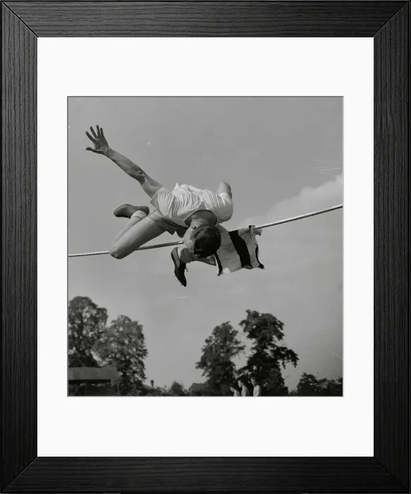 Framed Print : Art Jackes Straddling High Bar During Jump Framed Print : Art Jackes Straddling High Bar During Jump