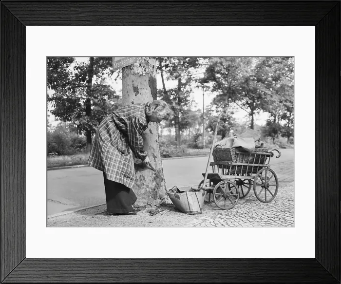 Framed Print : Berlin Housewife Scraping Tree for Kindling