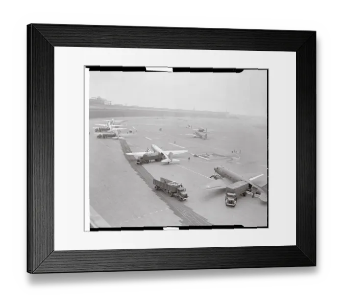 Framed Print : Airplanes and Trucks on Runway Framed Print : Airplanes and Trucks on Runway