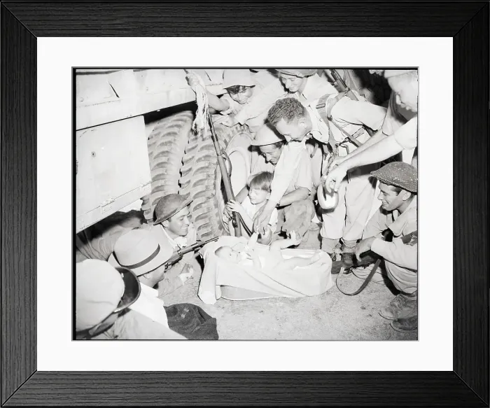 Framed Print : Soldiers Playing With Small Baby Framed Print : Soldiers Playing With Small Baby
