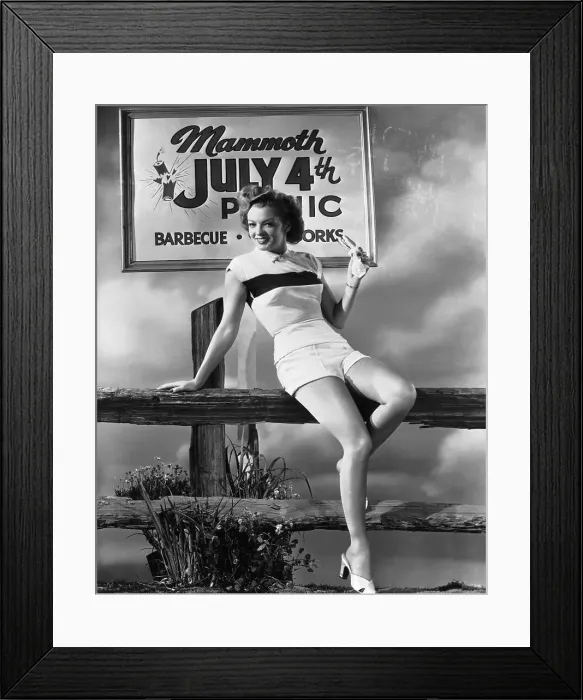Framed Print : Myrna Dell Leaning on Fence with Hot Dog