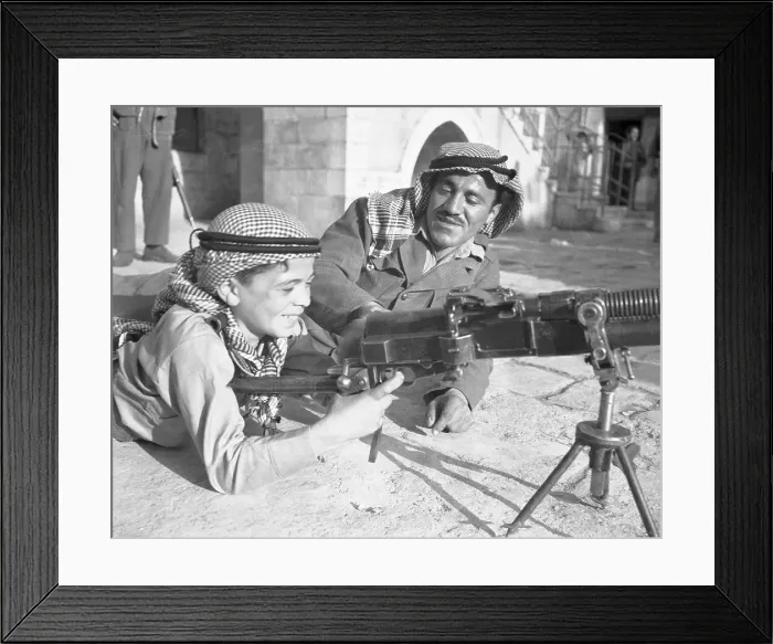 Framed Print : Arab Boy Learning About Machine Gun