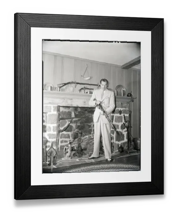 Framed Print : Cesar Romero Checking Gun In Living Room Framed Print : Cesar Romero Checking Gun In Living Room