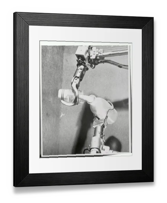Framed Print : Mechanical Hands Pouring Milk From a Bottle